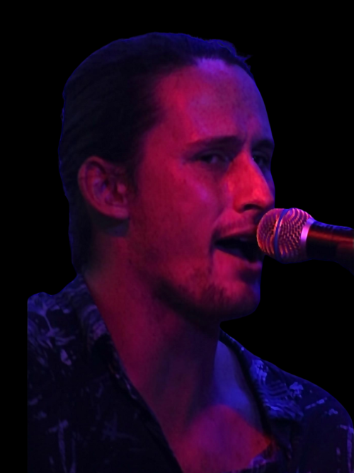 Brendan Verstraeten singing into a mike with the camera zoomed into my face.